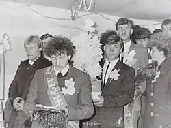 A groomsman reading a ritual text