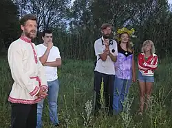 Russian farmer family in 2010, showing a mix of contemporary clothing and traditional folk costume elements.