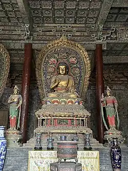 Ming dynasty (1368–1644) statue of Amoghasiddhi in Huayan Temple in Datong, Shanxi, China, one out of a set of statues of the Five Tathagathas