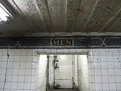 Mosaics above the former men's restroom
