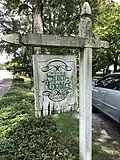 Sign along the Scott Street side of the property proclaiming it as the "House of Seven Gables, circa 1870"