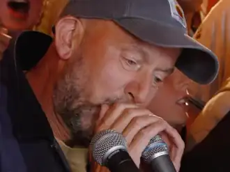 Thistlethwaite playing harmonica in 2014