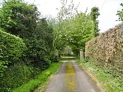 Bloxworth House, including the attached wall and gate piers on east
