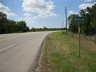 Bonus sign is on FM 102 north of the FM 2614 junction.