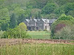 a country house surrounded by trees