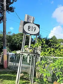 Sign for PR-819 in Mucarabones, Toa Alta, looking north