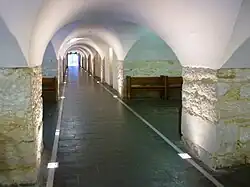 View of the crypt from west to east showing the low curved ceiling and the bays created by the junctions of the arches