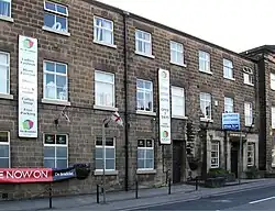 Mills occupied by George Brettle and Company Limited (that part along the Chapel Street frontage, bounded on the north by the 1834 building, including northern rear wing, and, on the south, by the recessed, single-storey red-brick building)