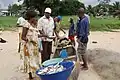 Fishermen selling fish, 2010