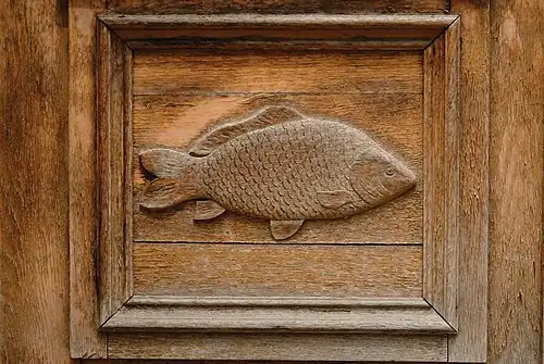 Detail from the entrance door: carved common carp