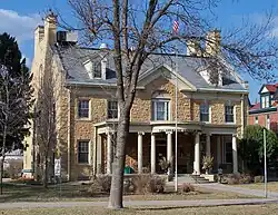 Photo of exterior of stately stone house