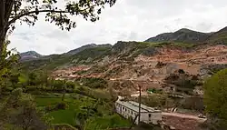 The Chrome mine in Qukës with a partial view of the village