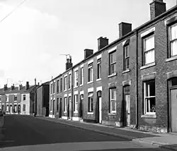 A row of brick-built terraced housing