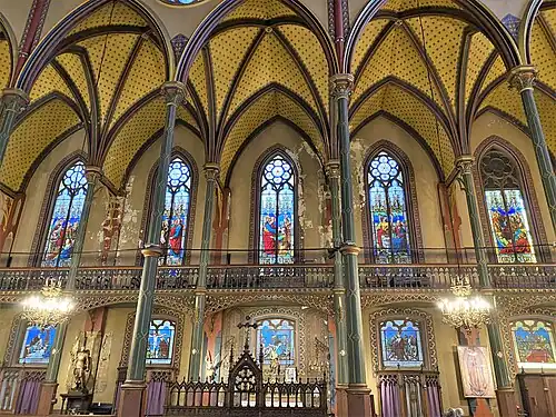 Side of the choir and nave, with 'Stations of the Cross" windows on lower level