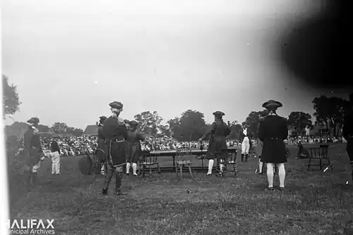 Actors in costume and crowds gathered to watch the re-enactment of Cornwallis' landing. This photo is likely from the 175th anniversary of the founding of the city of Halifax, August 4 to 16, 1924, part of a Natal Day celebration.[11]