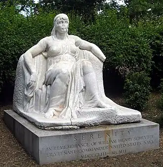 Damaged marble statue of a seated woman