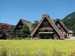 Rural landscape with houses with thatched roofs