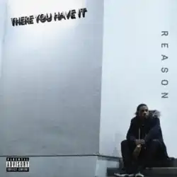 Man sitting on the steps next to a concrete wall.