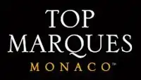 Top Marques Monaco logo, consisting of the event name in all-caps serif font, white text on black, with "Monaco" smaller and in gold