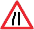 Road narrows on the left side