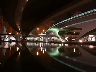 Riverbed view of Montolivet Bridge at night, looking south