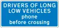 Information sign for large vehicles informing to phone at automatic level crossing