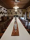 Dining room with hunting trophies lining the walls