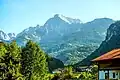 The Kehlsteinhaus visible atop the tree-covered mountain (right background)