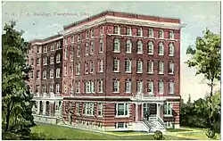 Black and white photograph with hand coloring