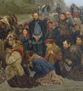 A standing man and praying peasants