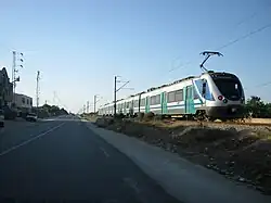 A train runs near the city of Mahdia.