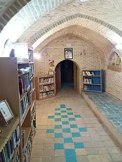 Picture of a downstairs and a teenager's bookcase the Bath of Shah Rokn al-Din Photo by Hossein Daramad