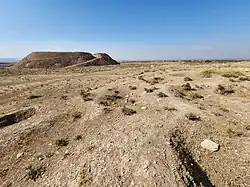 November 4, 2022, Bakr Awa mound. An area before the tell pockmarked with looters' pits