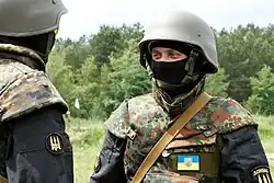 Two uniformed soldiers facing each other