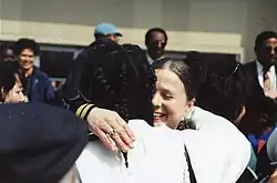 Two protesters embrace