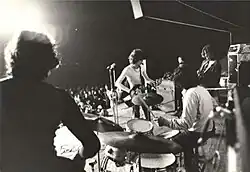 Black-and-white photo of the band onstage