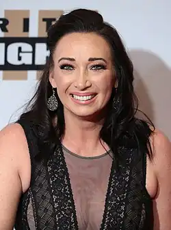 American swimmer Amy Van Dyken, shown from about the chest while smiling.