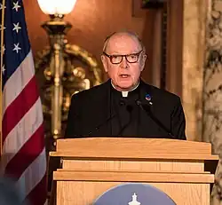 Leo J. O'Donovan at a podium in the Dutch Embassy, Washington, D.C.