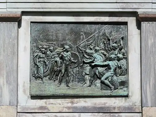The relief on one side of the plinth