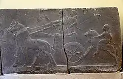 Assyrian chariot, charioteer, and a horse rider. Basalt wall relief. From the palace of Tiglath-pileser III at Hadatu, Syria. 744-727 BCE. Ancient Orient Museum, Istanbul
