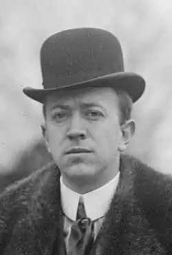 Photograph of a man wearing a hat