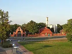 Main entrance gate and church of the Holy Cross