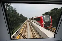 The four-car train sets of the Capital Airport Express have linear motors of instead of rotary motors. Capital Airport Express trains draw 750V DC power from the third rail, and are propelled using the aluminum strip, a "fourth rail", between the main track. Capital Airport Express trains sets are lighter than subway cars with rotary motors and can reach a top speed of 110 km/h (68 mph).