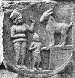 Woman with child and goat