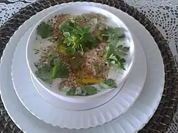 A yogurt-based soup garnished with parsley.