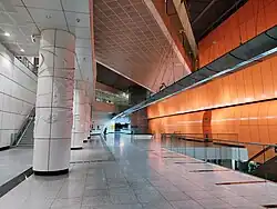 Sculpted white pillars supporting the CCL station at the spacious concourse level