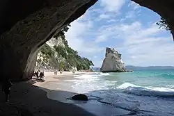 Sea arch at Cathedral Cove, carved in tuff[10] deposited by a pyroclastic flow about 8 million years ago