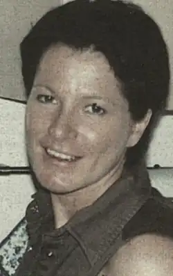 Rey-Bellet portrait photo. She is wearing a collared shirt and looking directly into the camera.