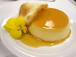 A tuile arced over a creme caramel dessert