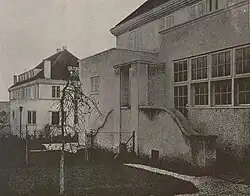 Two concrete 2-story dwellings